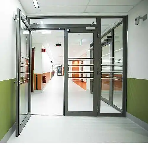 Fire rated steel door with side light and top light in hospital corridor, EI2 30